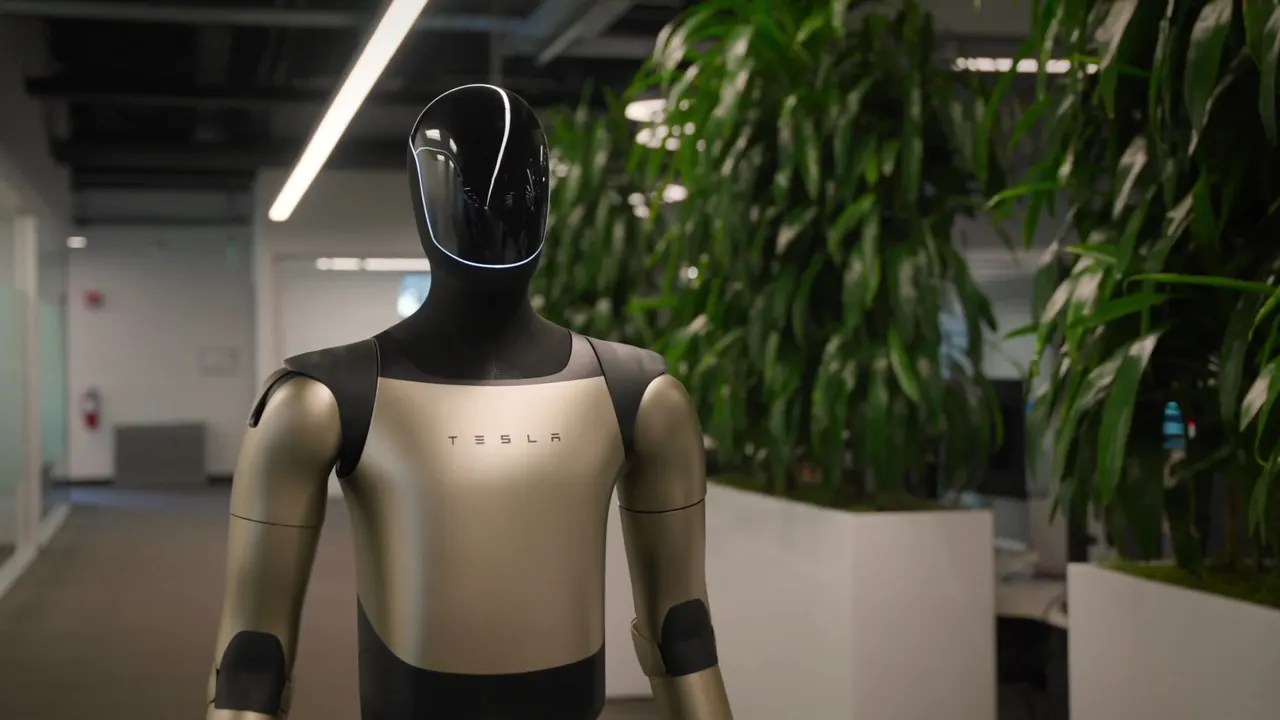 Optimus standing in a Tesla office